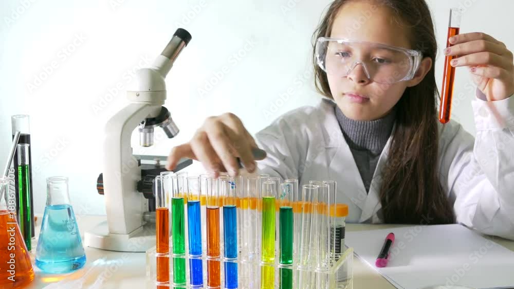 Young girl doing science experiment Young girl doing science experiment