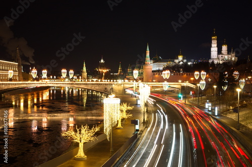 Evening view of the Moscow Kremlin, the Big Moskvoretsky bridge and Moskvoretskaya embankment with Christmas illuminations, Moscow, Russia