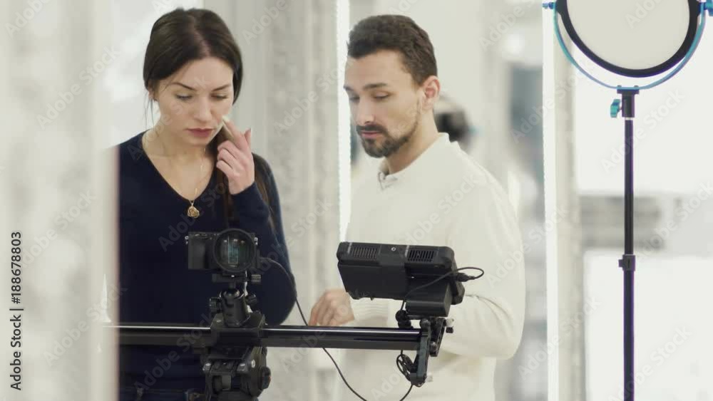 Producer and operator discussing some moments during shooting film Producer and operator discussing some moments during shooting film