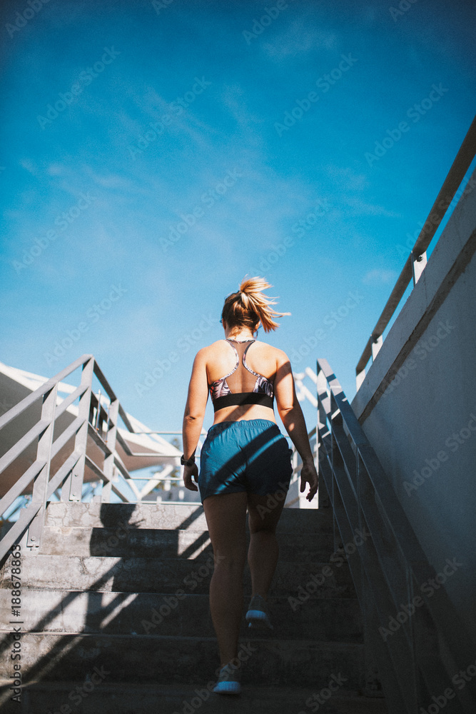 Back view of female athlete in sportswear Back view of female athlete in sportswear