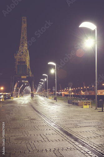 Szczecin (Stettin) City boulevards at night, vintage toned picture with lens flare, Poland.