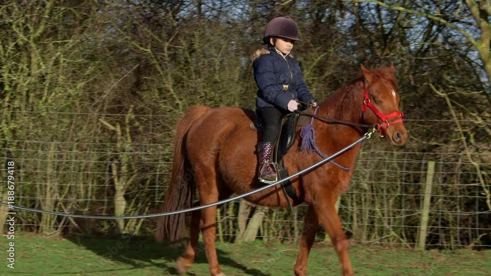 Teaching Girl To Ride Pony; Learning To Ride A Pony; Catwick, East Yorkshire Teaching Girl To Ride Pony; Learning To Ride A Pony; Catwick, East Yorkshire