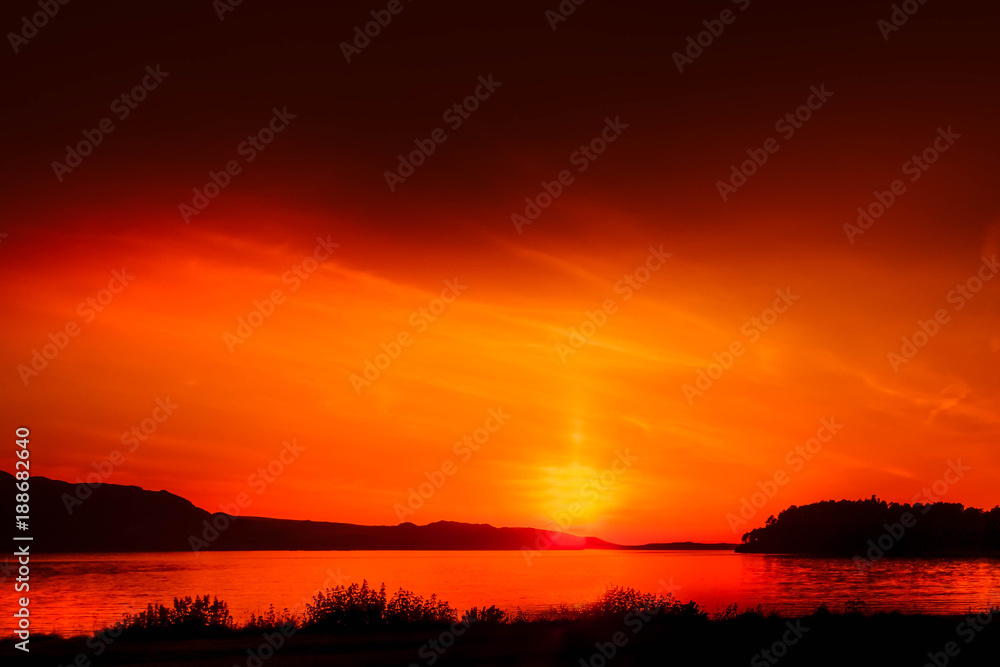 red sunset over loch maree in scotland