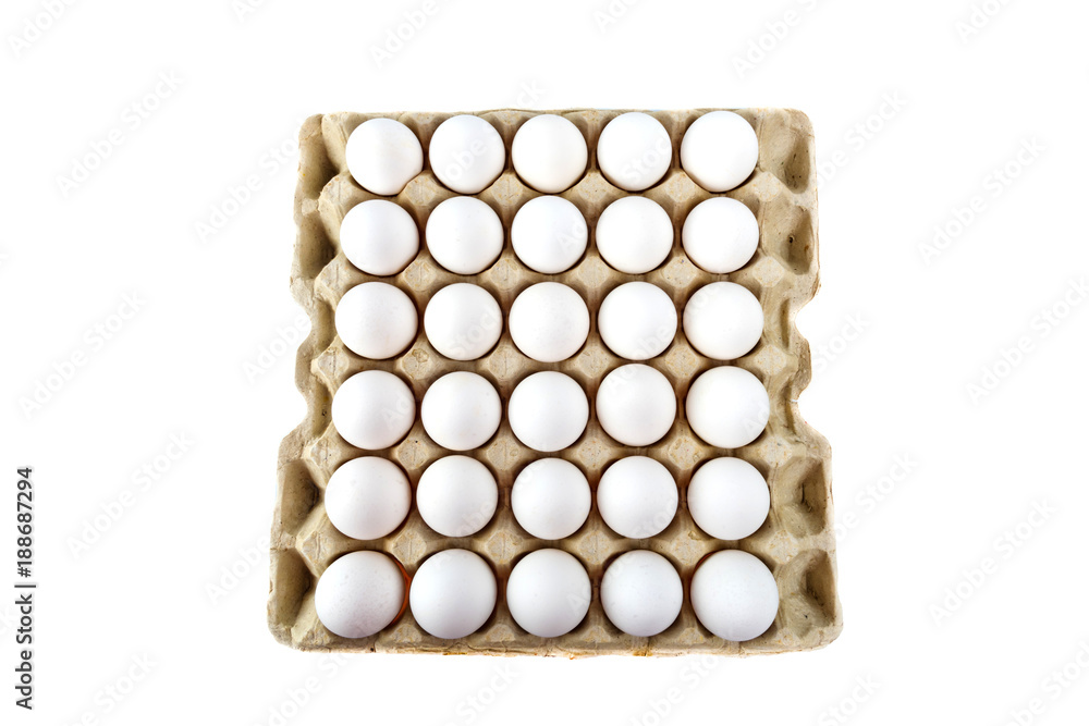 Eggs in tray of carton isolated on white background. Top view. Eggs in tray of carton isolated on white background. Top view.