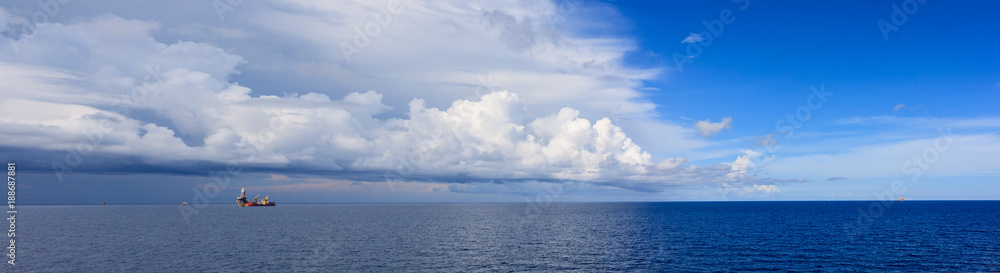 Panorama Blue sea and blue sky with white cloud Panorama Blue sea and blue sky with white cloud in oil and gas platform background.. Panorama Blue sea and blue sky with white cloud Panorama Blue sea and blue sky with white cloud in oil and gas platform background..