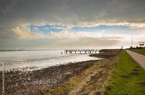Shore path at the mouth of the river Eider in the North Sea - T  nning  Germany