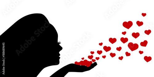 Female silhouette blows hearts from palm