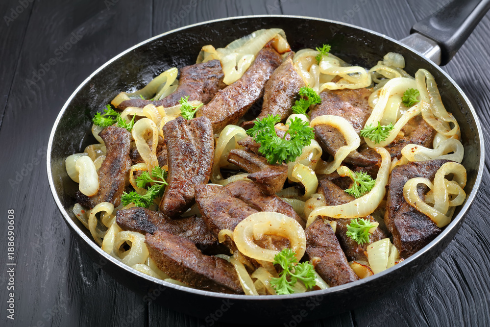fried calves liver pieces with onion rings fried calves liver pieces with onion rings