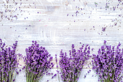 Bunch of dry lavender flowers on rustic background top view mock