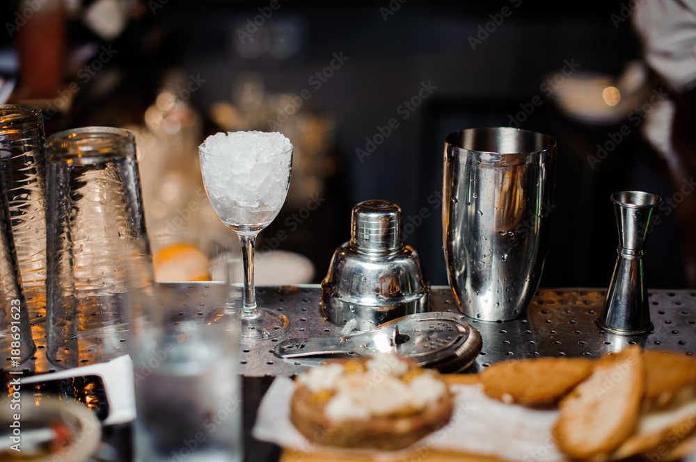 Washed professional bar equipment on the bar counter