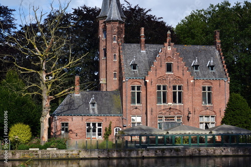 Minnewater Lake of love with Kasteel Minnewater in Bruges, Belgium photo