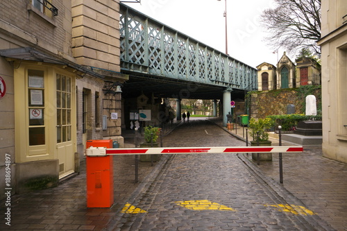 Paris,France-January 18, 2018: Montmartre cemetery is the third largest neropolic in Paris. Its sole entrance is on Avenue Rachel under Rue Caulaincourt.
 photo