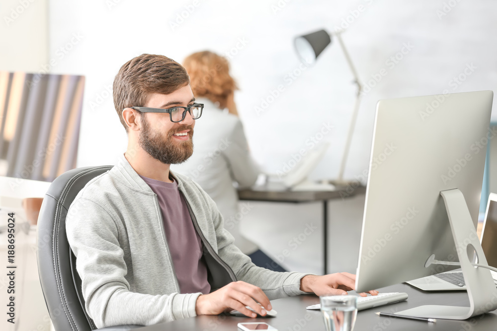 Manager working with computer in office Manager working with computer in office