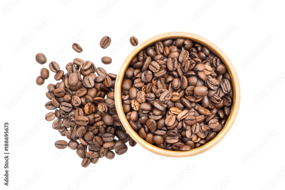 Coffee beans in a wooden bowl with a pile next to it seen from above isolated on white background Coffee beans in a wooden bowl with a pile next to it seen from above isolated on white background