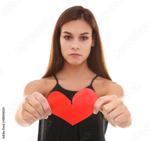 Unhappy woman tearing paper...