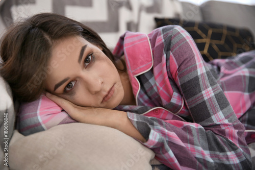 Depressed young woman after...