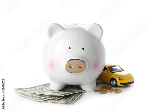 Piggy bank, money and toy on white background. Concept of buying new car