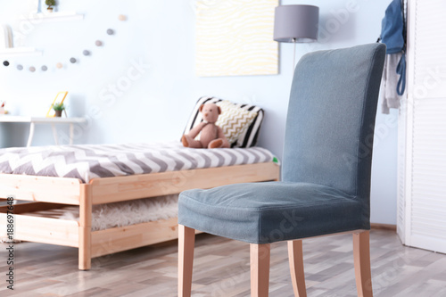 Interior of bedroom with comfortable armchair