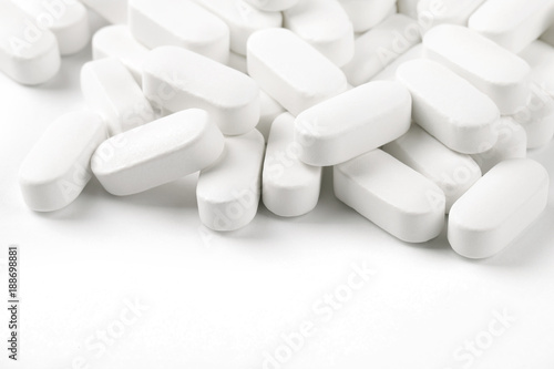  white pills oval shape on a white background