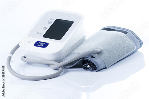 Digital blood pressure monitor on the white background