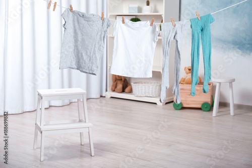 Clothes hanging on laundry line indoors