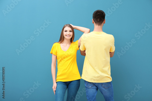 Young woman and man in yell...
