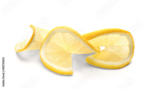 Slices of fresh ripe lemon on white background
