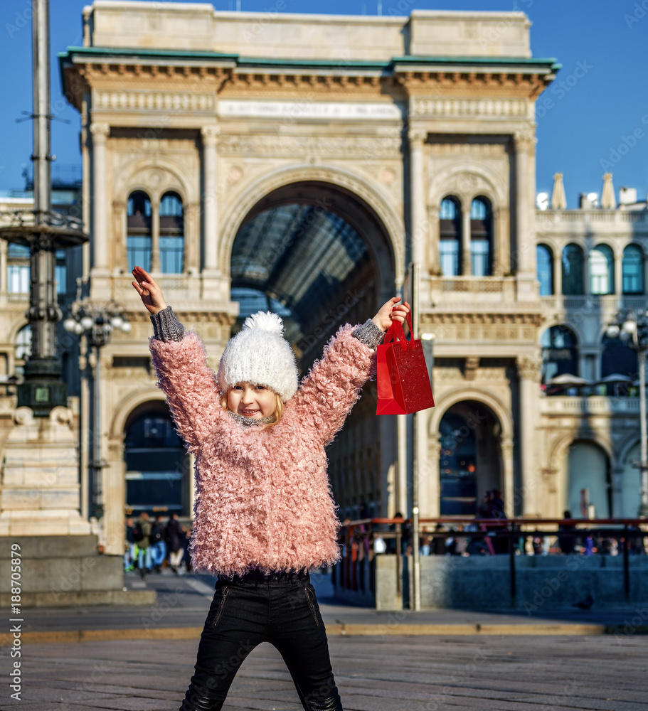 smiling girl near Galleria Vittorio Emanuele II rejoicing