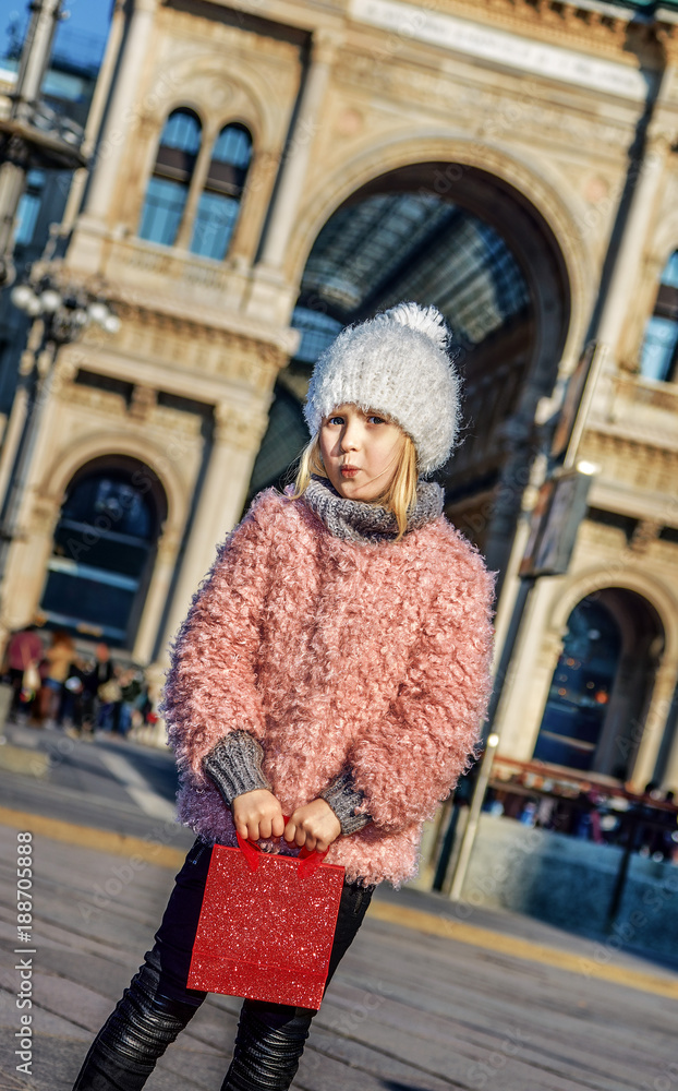 modern girl standing at Piazza del Duomo in Milan, Italy