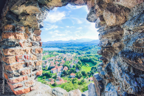 View of Avigliana town throw a window of an old castell