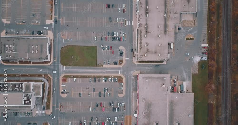 Drove aerial over busy shopping center parking lot Drove aerial over busy shopping center parking lot