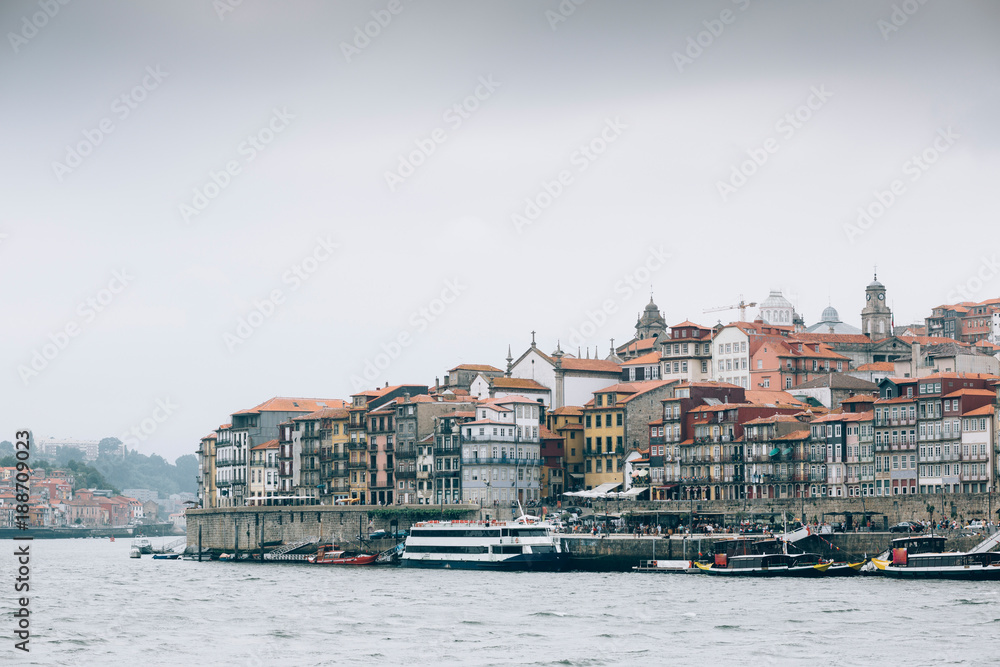 Boats floating in city river of Porto.