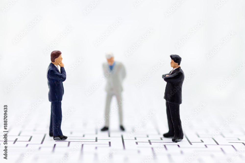 Miniature people, Businessmen stand on opposite sides of the chess game, separate party , benefit, use as a business competition concept.