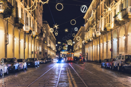 27 December 2017, Torino (TO) Italy: View of a main street of Turin. Christmas artist lights lit above the road.