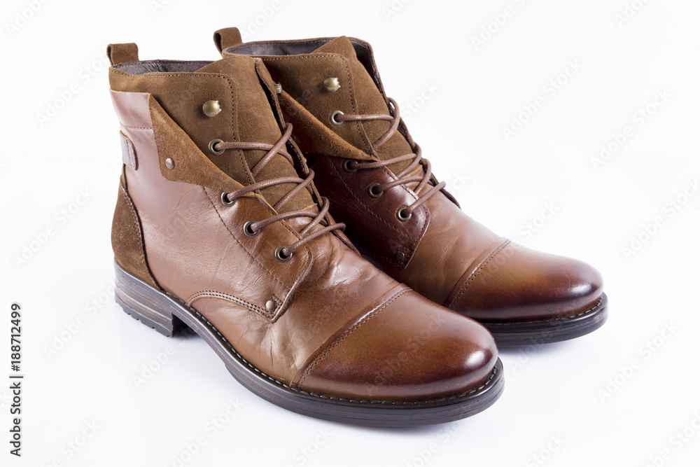 Male brown leather boot on white background, isolated product, comfortable footwear. Male brown leather boot on white background, isolated product, comfortable footwear.