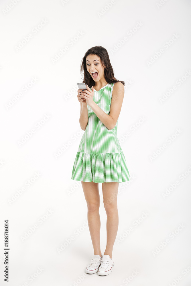 Full length portrait of an excited girl in dress Full length portrait of an excited girl in dress