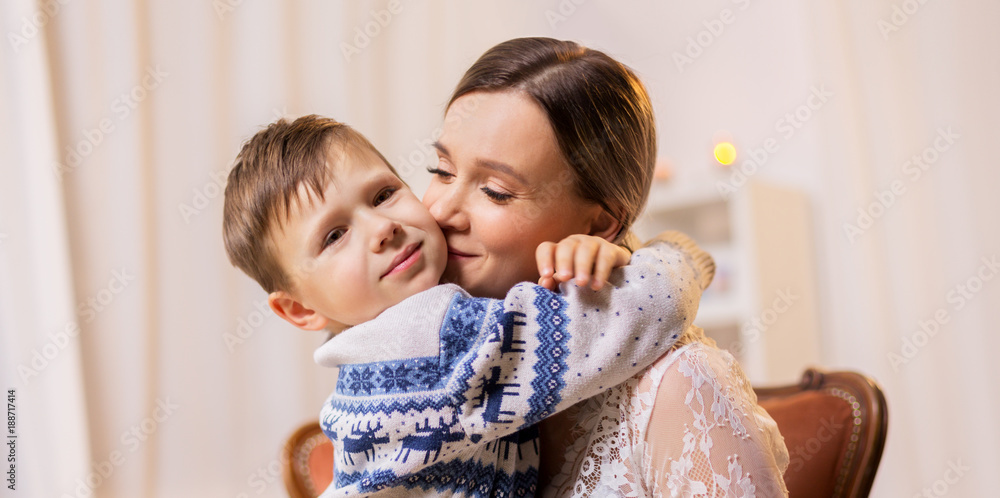 happy mother hugging and kissing her little son happy mother hugging and kissing her little son