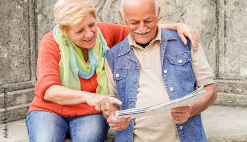 Photography Senior couple reading tourist map inside italian castle outdoor - Mature Husband
