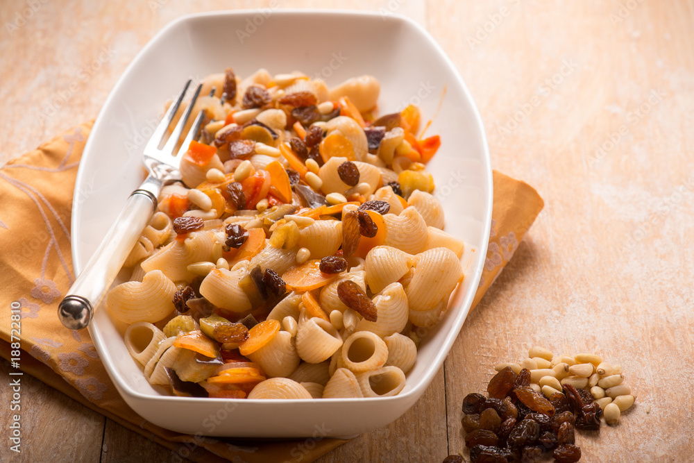 oriental pasta with dried grape pine nuts and carrot, SELECTIVE FOCUS oriental pasta with dried grape pine nuts and carrot, SELECTIVE FOCUS