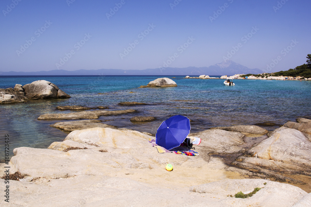 Orange beach, Sithonia, Greece. Beach umbrella Orange beach, Sithonia, Greece. Beach umbrella
