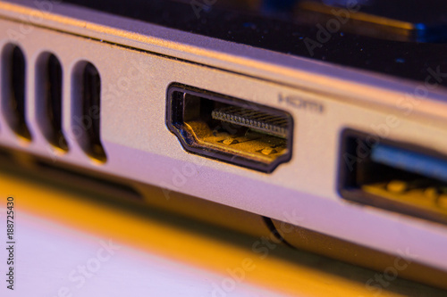 Closeup of HDMI cable port in a laptop.