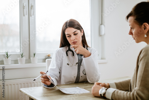 Serious doctor discussing test results with patient.