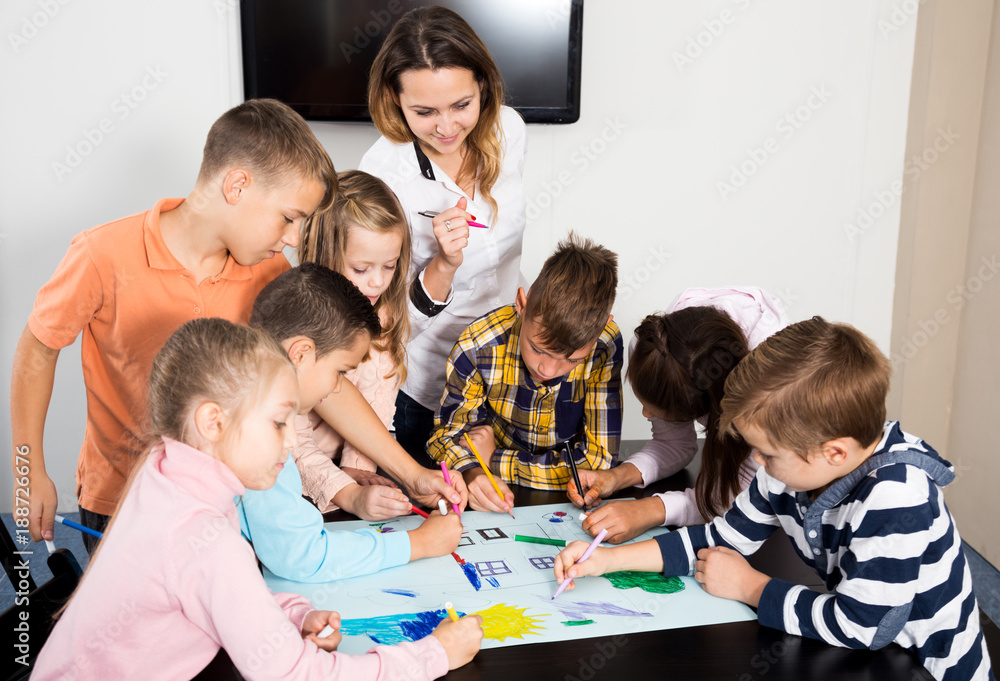 Team of elementary age children  drawing