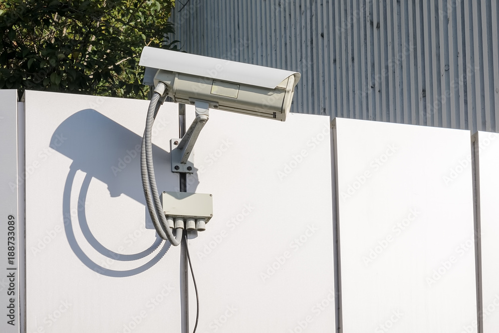 Security surveillance camera on the wall of a modern building