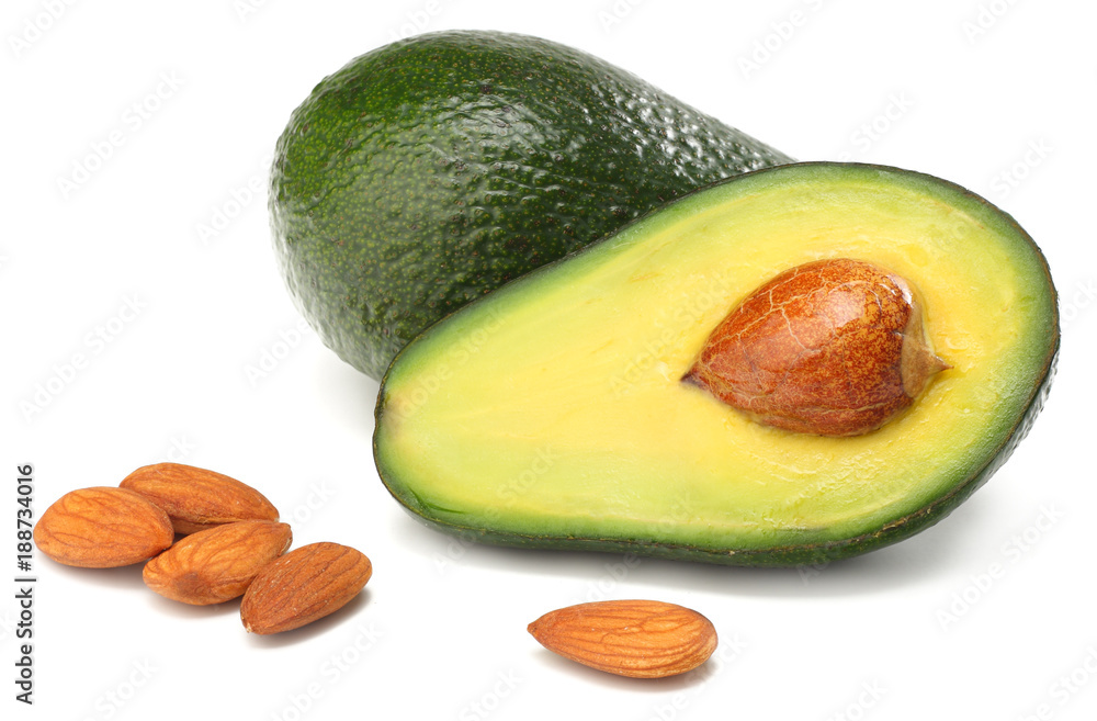 healthy food. sliced avocado with almonds isolated on white background healthy food. sliced avocado with almonds isolated on white background