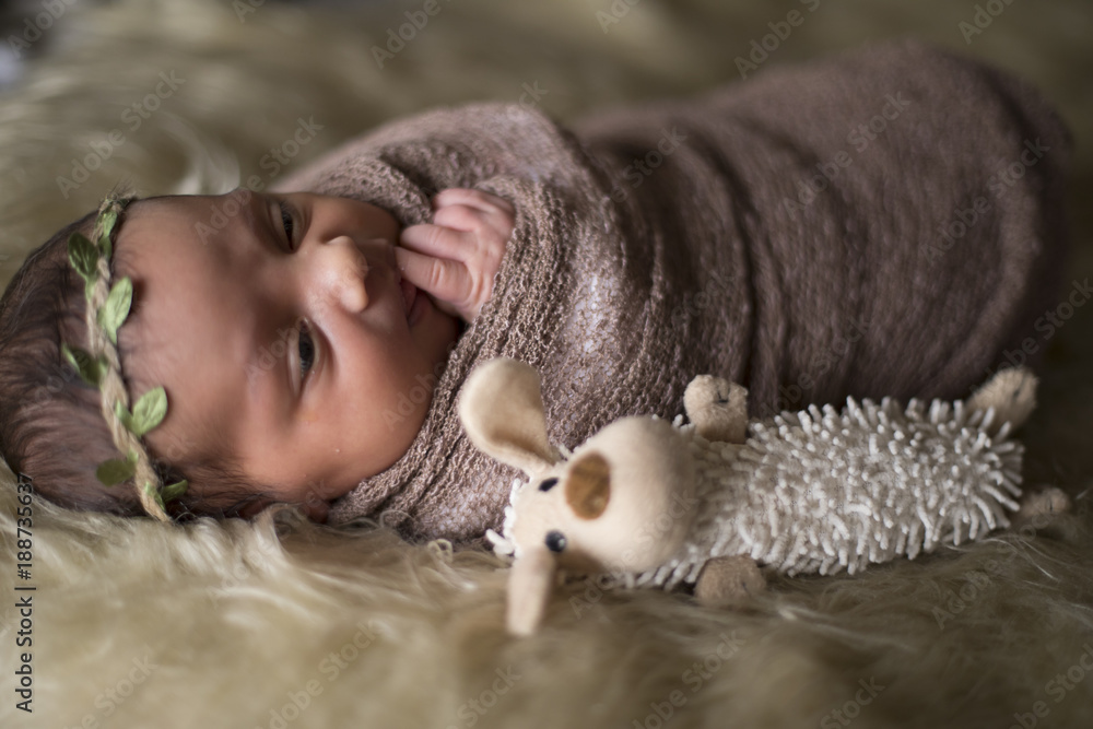 Newborn girl laying in bed Newborn girl laying in bed