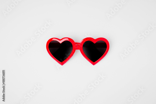 Sunglass in the shape of a heart on a white background