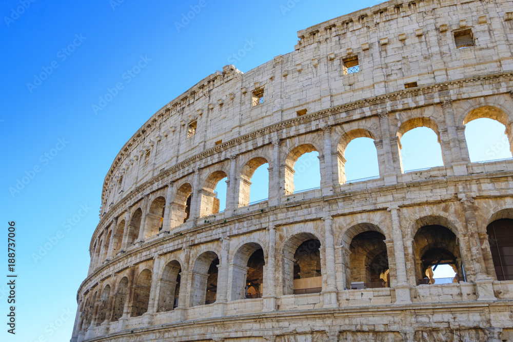 Colosseum Rome. Ruins of the  ancient Roman amphitheatre. Travel to Italy, Europe. Crowd and queue. Sunny day and blue sky