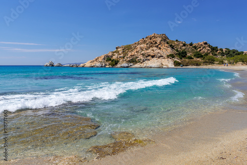Sea with with shallow crystal clear sea water, Mikri Vigla beach on Naxos island, Greece