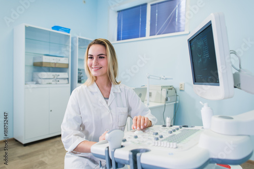 portrait of young female dentist in office